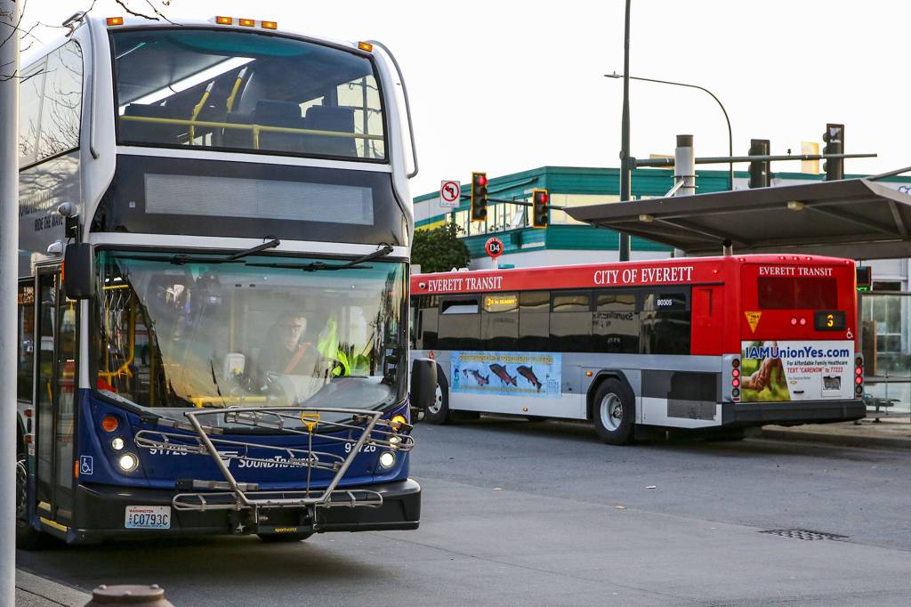 Sound Transit and Everett buses line up at Everett Station on Thursday. (Kevin Clark / The Herald)