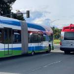 A Community Transit Swift bus and an Everett Transit bus on Rucker Avenue in Everett. (Sue Misao / Herald file)