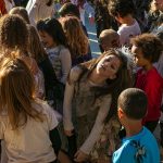 Youth contestants moan and groan during a zombie-off during the 10th annual Snohomish Zombie Walk on Saturday, Oct. 28, 2023, in downtown Snohomish, Washington. (Ryan Berry / The Herald)