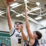 Jacksons Henry Johnson makes a layup during the game against Arlington on Tuesday, Nov. 28, 2023 in Everett, Washington. (Olivia Vanni / The Herald)