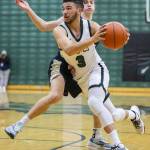 Jacksons Trey Hawkins drives to the hoop during the game against Arlington on Tuesday, Nov. 28, 2023 in Everett, Washington. (Olivia Vanni / The Herald)
