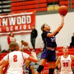 Kamiak’s Bella Hasan finishes at the rim with a driving layup against Stanwood on Thursday, Nov. 30, 2023, at Stanwood High School in Stanwood, Washington. (Ryan Berry / The Herald)