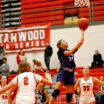 Kamiaks Bella Hasan finishes at the rim with a driving layup against Stanwood on Thursday at Stanwood High School in Stanwood. (Ryan Berry / The Herald)