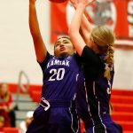 Kamiaks Synclair Mawudeku and Brooklyn Huguenin both reach for a rebound against Stanwood on Thursday, Nov. 30, 2023, at Stanwood High School in Stanwood, Washington. (Ryan Berry / The Herald)