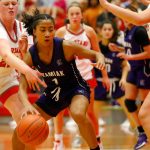 Kamiak sophomore Zia-Daye Anderson gets pressured by the Stanwood defense on Thursday, Nov. 30, 2023, at Stanwood High School in Stanwood, Washington. (Ryan Berry / The Herald)