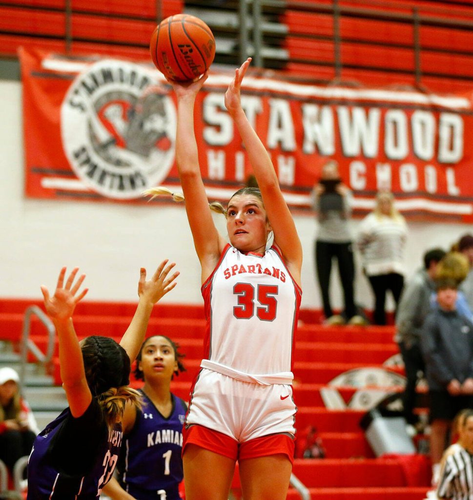 Stanwood sophomore Stella Berrett shoots a midrange jumper against Kamiak on Thursday, Nov. 30, 2023, at Stanwood High School in Stanwood, Washington. (Ryan Berry / The Herald)