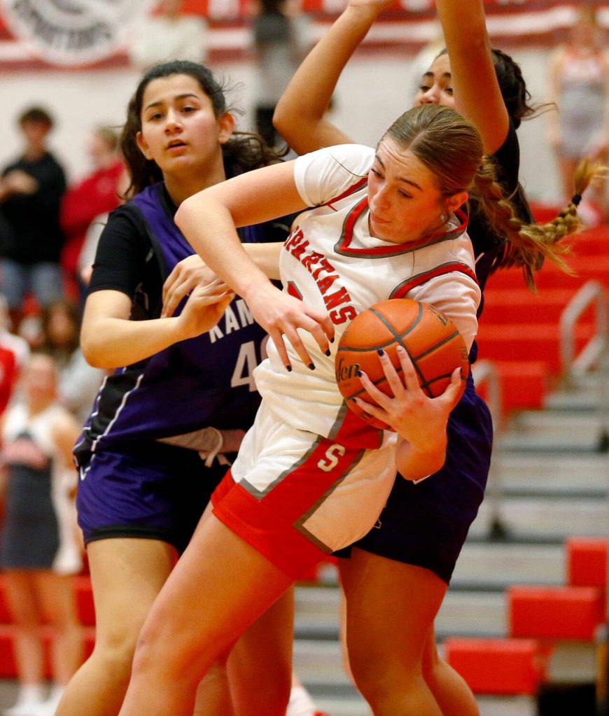 Stanwoods Ellalee Wortham spins out of trouble with the ball against Kamiak on Thursday, Nov. 30, 2023, at Stanwood High School in Stanwood, Washington. (Ryan Berry / The Herald)