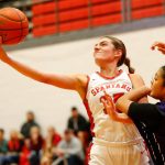 Stanwoods Stella Berrett comes down with a rebound against Kamiak on Thursday, Nov. 30, 2023, at Stanwood High School in Stanwood, Washington. (Ryan Berry / The Herald)