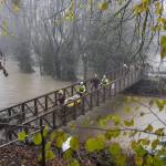 Snohomish Regional Fire and Rescue crews leave Al Borlin Park after rescuing three stranded people on Tuesday, Dec. 5, 2023 in Monroe, Washington. (Olivia Vanni / The Herald)