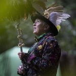 Cassandee Meter invokes the Roman god Mercury during GodCon in Index, Washington, on July 22, 2023. Invocation takes preparation: wearing the right clothes, researching the spiritual entity and making proper offerings. A host then interprets messages. From Krampus to Zeus, to depicting major arcana of the tarot, all interpretations are fair game at the Aquarian Tabernacle Church. (Annie Barker / The Herald)