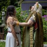 Aedis LaVeau, left, listens to a message from Demeter, the Greek goddess of agriculture, through Archpriestess Belladonna Laveau during the Lammas and Wicker Man ritual at the Aquarian Tabernacle Church in Index, Washington, in August 2023. (Annie Barker / The Herald)