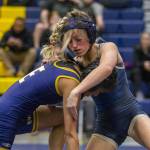 Arlingtons Araxi Crew wrestles during a wrestling scramble at Everett High School on Wednesday, Dec. 13, 2023 in Everett, Washington. (Olivia Vanni / The Herald)