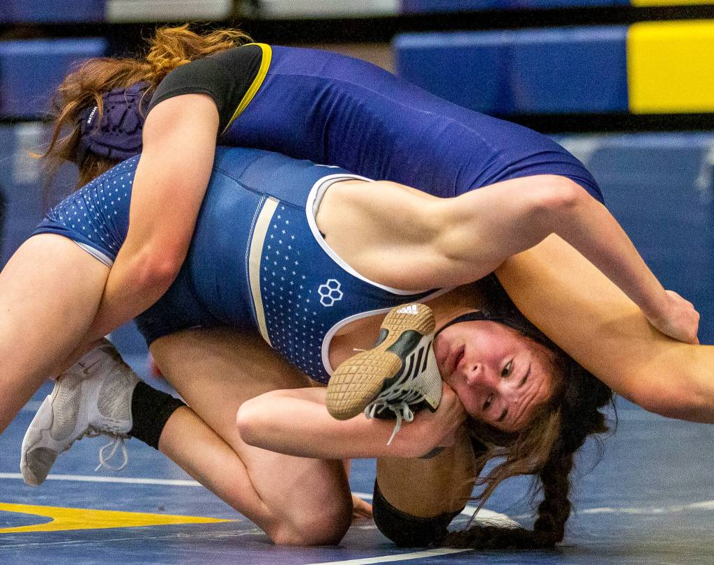 Arlington’s Danielle Crew wrestles during a wrestling scramble at Everett High School on Wednesday, Dec. 13, 2023 in Everett, Washington. (Olivia Vanni / The Herald)