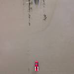 A red truck navigates through floodwaters covering 28th Avenue NW along Pioneer Highway on Wednesday, Dec. 6, 2023, in Stanwood, Washington. Communities near the mouth of the Stillaguamish River remained flooded that day in the aftermath of a major rainstorm. Emergency crews responded to at least 13 rescues. (Olivia Vanni / The Herald)