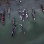 Dozens of colorful canoes maneuvered into the water of Tulalip Bay, as Canoe Families began another day of their journey to Muckleshoot on Friday, July 28, 2023, in Tulalip, Washington. (Olivia Vanni / The Herald)