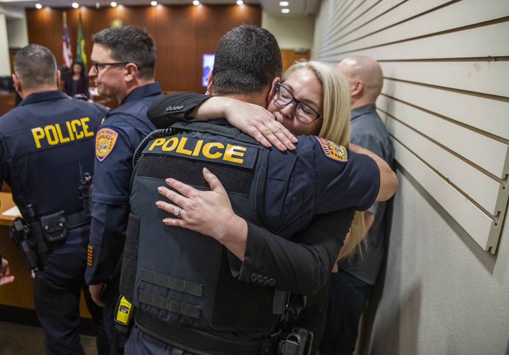 Olivia Vanni / The Herald
Snohomish County Sheriffs Office detective Kendra Conley hugs Everett police Lt. Tim Collings after Richard Rotter was found guilty on April 3 in Everett. Rotter got life without parole for slaying Everett police officer Dan Rocha in March 2022.