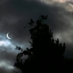 Clouds pass in front of the moon and sun as the two cross paths during an annular eclipse on Saturday, Oct. 14, 2023, seen from Everett, Washington. A total eclipse will be visible over parts of the United States in April 2024. (Ryan Berry / The Herald)