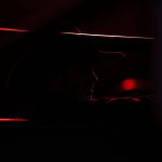 A man wearing a cowboy hat looks out into the arena during PBR: Unleash The Beast at Angel of the Winds Arena on Thursday, April 20, 2023, in Everett, Washington. (Annie Barker / The Herald)