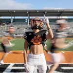 Sophomore wide receiver and free safety Gino Howard (20) poses for a portrait between practicing drills at Granite Falls High School on Wednesday, Oct. 11, 2023, in Granite Falls, Washington. (Annie Barker / The Herald)