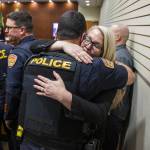 Snohomish County Sheriffs Office detective Kendra Conley, right, hugs Everett police Lt. Tim Collings, left, after the reading of the verdict at the trial of Richard Rotter at the Snohomish County Courthouse on Monday, April 3, 2023, in Everett, Washington. Rotter, who murdered Everett police officer Dan Rocha in March 2022, was sentenced to life in prison without the possibility of parole. (Olivia Vanni / The Herald)