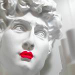Lipstick adorns a decorative statue at Bandbox Beauty. (Ryan Berry / The Herald)