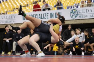 Iowa Hawkeyes' Alivia White, a Marysville Pilchuck High School graduate, executes a rare five-point throw that went viral during the NWCA National Dual Meet Championships on Jan. 5, 2024, at the UNI-Dome in Cedar Falls, Iowa. (Jerod Ringwald/hawkeyesports.com)
