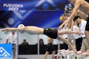 Matt King of the U.S. competes during a men's 400-meter medley relay heat at the World Swimming Championships in Fukuoka, Japan, Sunday, July 30, 2023. (AP Photo/Eugene Hoshiko)