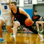Everett Community Colleges Ethan Martin drives down the baseline against Edmonds College on Feb. 7 at Seaview Gym in Lynnwood. (Ryan Berry / The Herald)