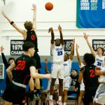 Edmonds Colleges Josiah Pierre puts up a 3-pointer against Everett Community College on Feb. 7 at Seaview Gym in Lynnwood. (Ryan Berry / The Herald)