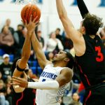 Edmonds College’s Chris Lee scores in traffic against Everett Community College on Wednesday, Feb. 7, 2024, at Seaview Gym in Lynnwood, Washington. (Ryan Berry / The Herald)