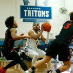 Edmonds Colleges Chris Lee head fakes a shot during a game against Everett Community College on Feb. 7, at Seaview Gym in Lynnwood. (Ryan Berry / The Herald)