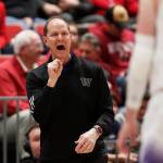Washington head coach Mike Hopkins directs his team during the first half of a game against Washington State on Thursday in Pullman. (AP Photo/Young Kwak)