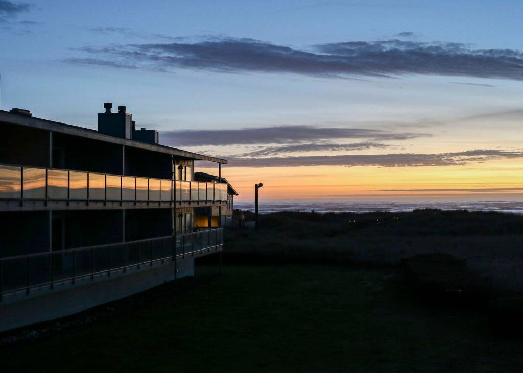 The decks at Hi-Tide Ocean Beach Resort reflect the evenings sun set colors on March 13 in Moclips, Washington. (Brenda Mann Harrison / Special to The Herald)