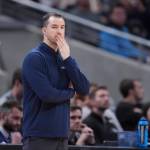 Utah State head coach Danny Sprinkle on the sidelines during an NCAA Tournament game against Purdue on Sunday in Indianapolis. (AP Photo/Michael Conroy)