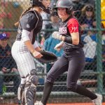 A Snohomish player scores a run during the 3A state softball semifinal game against Garfield on Saturday, May 25, 2024 in Lacey, Washington. (Olivia Vanni / The Herald)