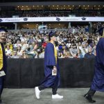 Graduates file into the arena during Arlington High School graduation at Angel of the Winds Arena on Thursday, June 13, 2024, in Everett, Washington. (Olivia Vanni / The Herald)