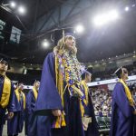 Gradutes walk down the center aisle to their seats during Arlington High School graduation at Angel of the Winds Arena on Thursday, June 13, 2024, in Everett, Washington. (Olivia Vanni / The Herald)