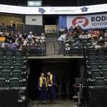 Kobi Spady, left, and Willem Van Dongen look out as people file in before the start of Arlington High School graduation at Angel of the Winds Arena on Thursday, June 13, 2024, in Everett, Washington. (Olivia Vanni / The Herald)