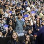 Family and friends cheer on graduates during Arlington High School graduation at Angel of the Winds Arena on Thursday, June 13, 2024, in Everett, Washington. (Olivia Vanni / The Herald)