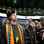 The Monroe High School class of 2024 enters the arena at the beginning of their commencement on Wednesday, June 12, 2024, at Angel of the Winds Arena in Everett, Washington. (Ryan Berry / The Herald)