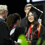 Students begin to cross the stage and receive their diplomas during Monroe High Schools 2024 commencement on Wednesday, June 12, 2024, at Angel of the Winds Arena in Everett, Washington. (Ryan Berry / The Herald)