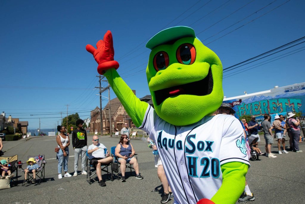 AquaSox mascot Webbly waves to the crowd during Everetts Fourth of July Parade on Thursday, July 4, 2024, in downtown Everett, Washington. (Ryan Berry / The Herald)