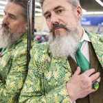 Tim Lambright inside Value Village wearing a completely thrifted outfit on Wednesday, April 5, 2023 in Everett, Washington. (Olivia Vanni / The Herald)
