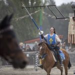 A performer uses his lance to target small rings during the Washington Midsummer Renaissance Faire at Sky Meadows Park in Snohomish, Washington, on Sunday, Aug. 06, 2023. (Annie Barker / The Herald)
