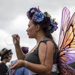An individual blows bubbles using their hand as a wand during the Washington Midsummer Renaissance Faire at Sky Meadows Park in Snohomish, Washington, on Sunday, Aug. 06, 2023. (Annie Barker / The Herald)