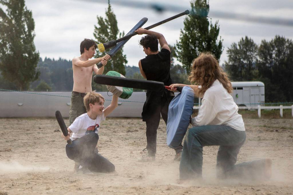 Kids feign battle during the Washington Midsummer Renaissance Faire at Sky Meadows Park in Snohomish, Washington on Sunday, Aug. 06, 2023. (Annie Barker / The Herald)