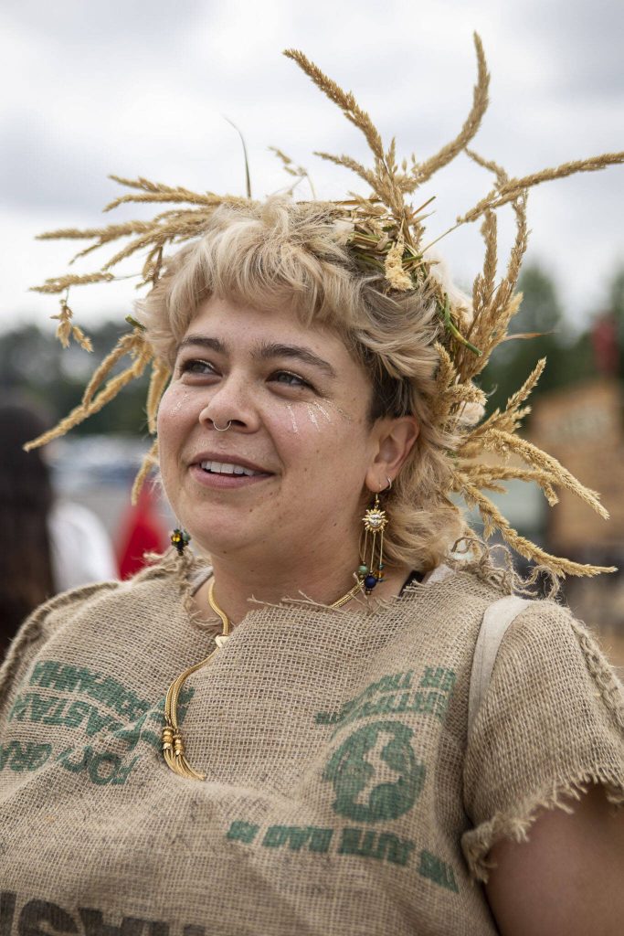 Maddie Bailey, 29, of Whidbey Island, poses for a photo while dressed as a harvest fairy during the Washington Midsummer Renaissance Faire at Sky Meadows Park in Snohomish, Washington on Sunday, Aug. 06, 2023. (Annie Barker / The Herald)