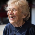 Kim Knor laughs as she waits to gear up for her 730th skydive at Skydive Snohomish on Wednesday, Aug. 14, 2024 in Snohomish, Washington. (Olivia Vanni / The Herald)