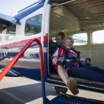 Kim Knor smiles after loading up into the airplane on Wednesday, Aug. 14, 2024 in Snohomish, Washington. (Olivia Vanni / The Herald)