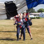 Kim Knor reacts to landing after her 730th skydive on Wednesday, Aug. 14, 2024 in Snohomish, Washington. (Olivia Vanni / The Herald)